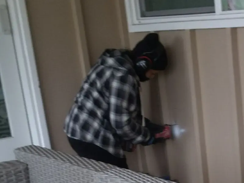 Professional electrician installing an exterior outlet in Tavares